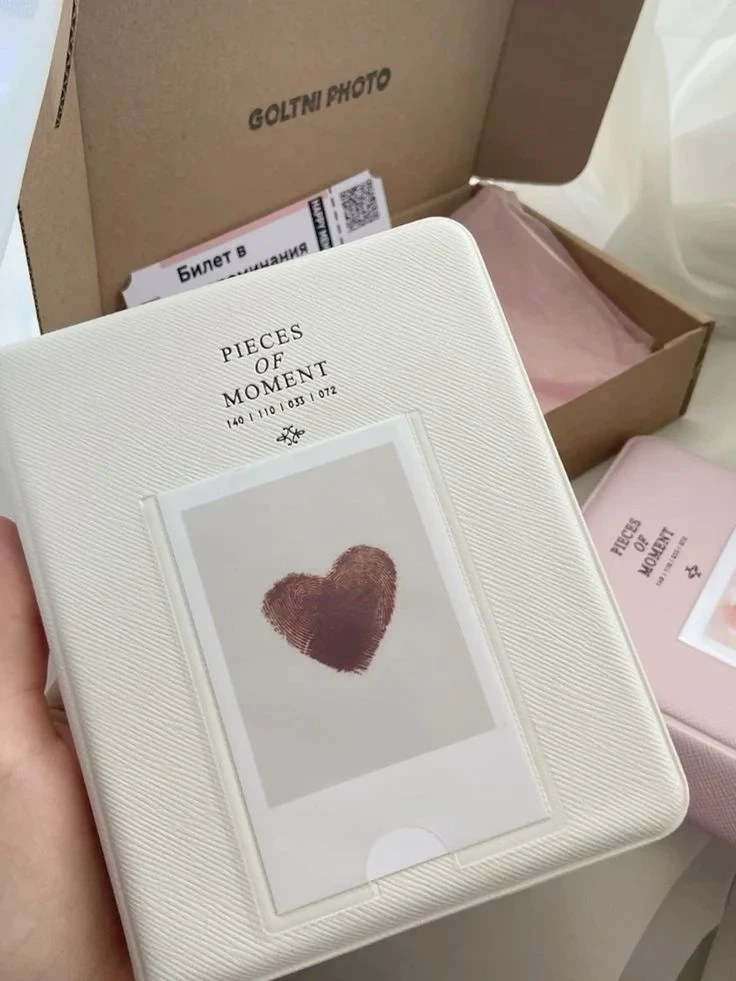 A textured Polaroid album with a photo on its cover